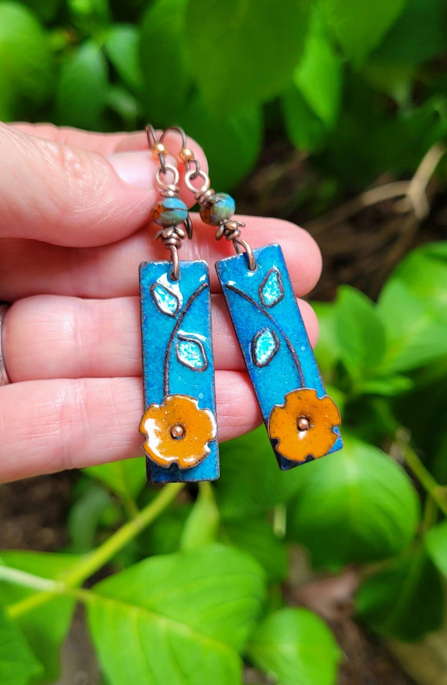 Boho Orange Flower Torch Enamel Earrings - handmade, light blue petals against a deep blue, copper, glass, lightweight, beautiful gift