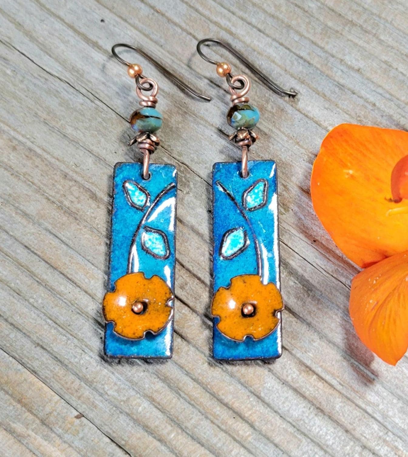 Boho Orange Flower Torch Enamel Earrings - handmade, light blue petals against a deep blue, copper, glass, lightweight, beautiful gift